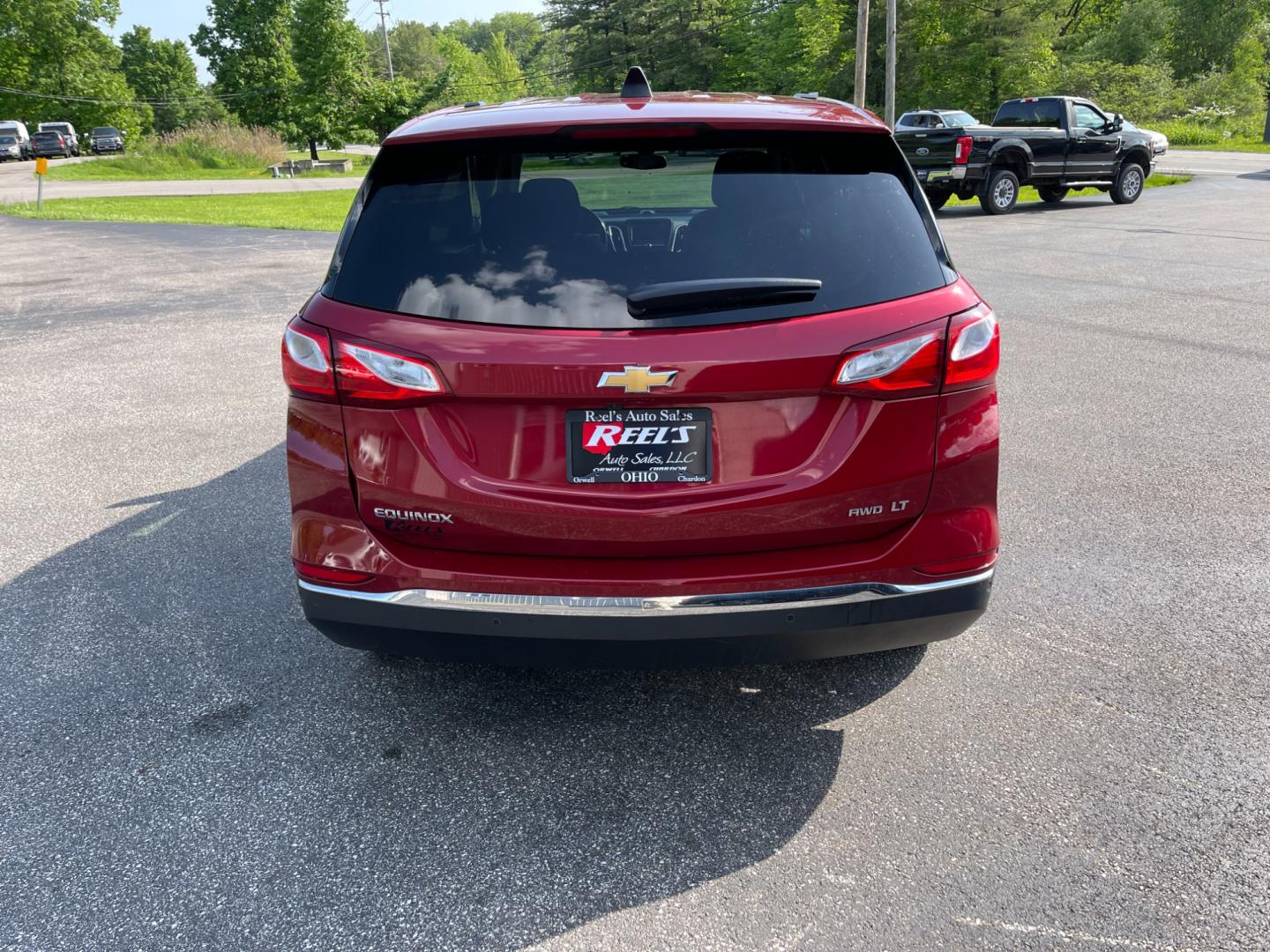 2018 Red /Black Chevrolet Equinox LT AWD (2GNAXSEV2J6) with an 1.5L I4 DOHC 16V TURBO engine, 6-Speed Automatic transmission, located at 11115 Chardon Rd. , Chardon, OH, 44024, (440) 214-9705, 41.580246, -81.241943 - This 2018 Chevrolet Equinox LT AWD with a 1.5L EcoTec Turbocharged engine and 6-speed automatic transmission offers a balanced blend of performance and fuel efficiency with a 30 MPG highway rating. This compact SUV is well-equipped for safety and convenience, featuring blind spot monitoring, rear cr - Photo#8